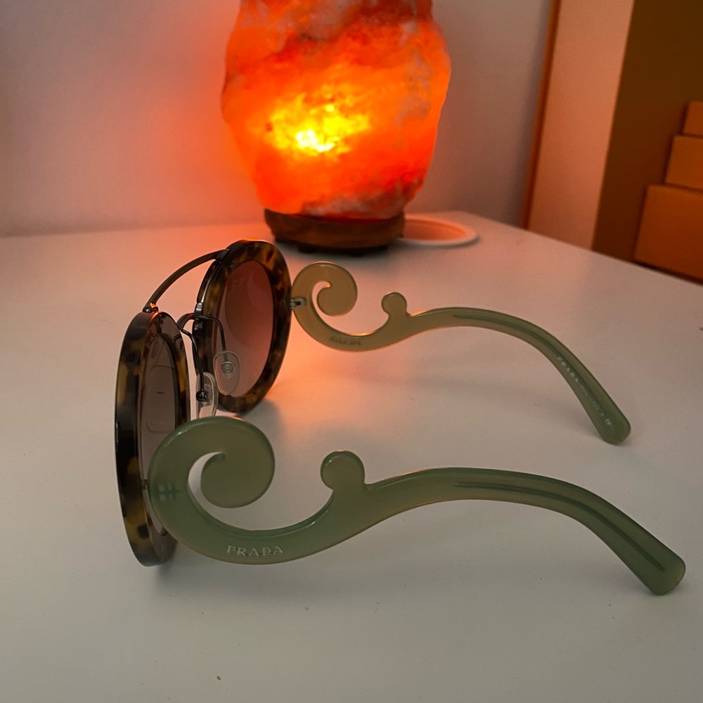 prada baroque glasses.